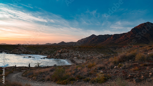 sunset over the mountains beach paradise © Vimaki