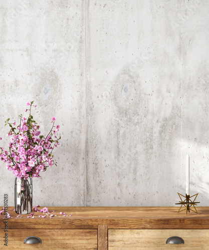 Interior scene: wooden sideboard with cherry blossoms in a vase and a candle on top. Blank concrete wall. 3d render photo