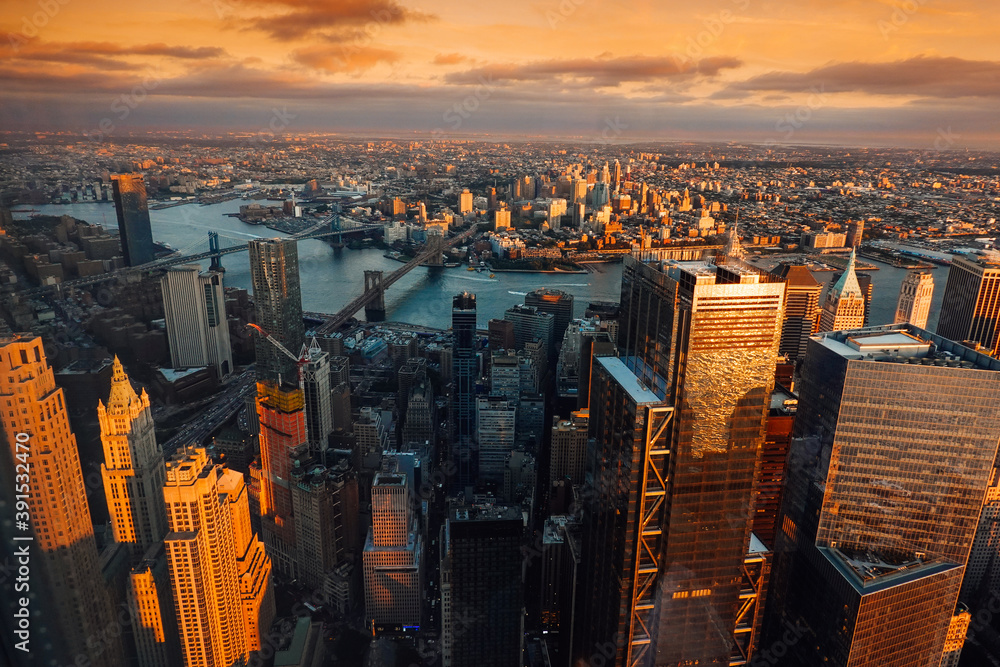 Amazing autumn sunset view from One World Trade Center  sky scraper in New York to South Manhattan with great colors