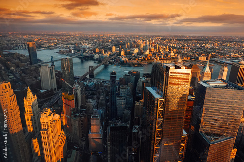 Amazing autumn sunset view from One World Trade Center sky scraper in New York to South Manhattan with great colors
