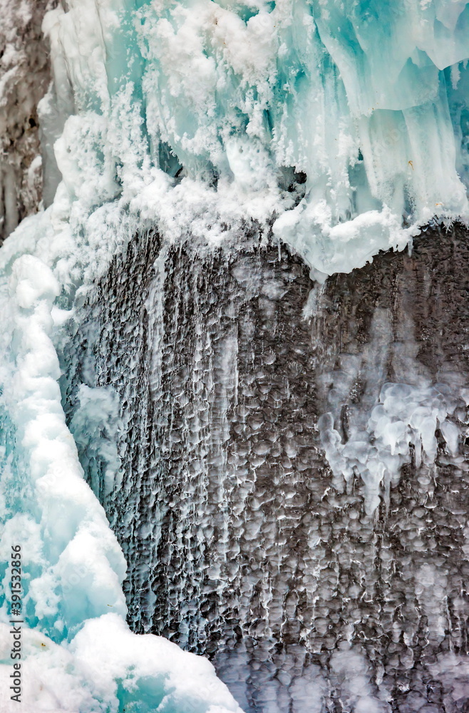 Icicles of ice from falling water in winter Icicles of ice from falling water in winter