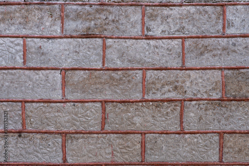 Old brick wall with red filling