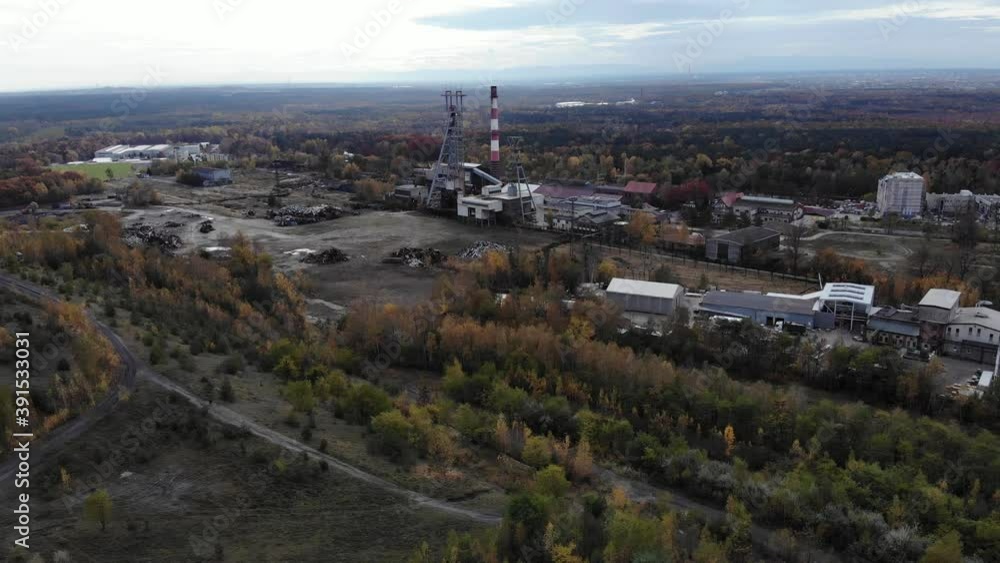Aerial view on coal mine. Warehouse in the background. 4K, UHD, Cinematic Aerial view on coal mine. Warehouse in the background. 4K, UHD, Cinematic