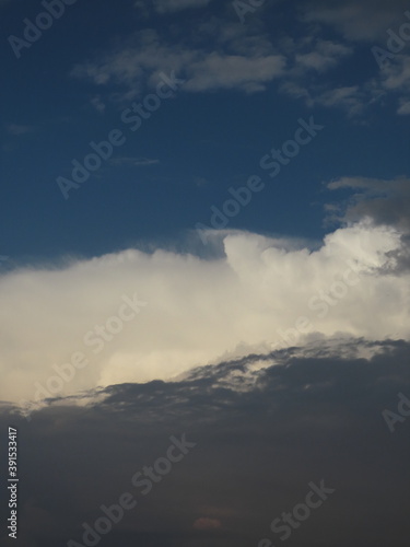 Beautiful multi-colored sky with a cloud before a thunderstorm and rain in autumn in Israel close-up. The photo can be used as a banner for advertising. There is room for text.