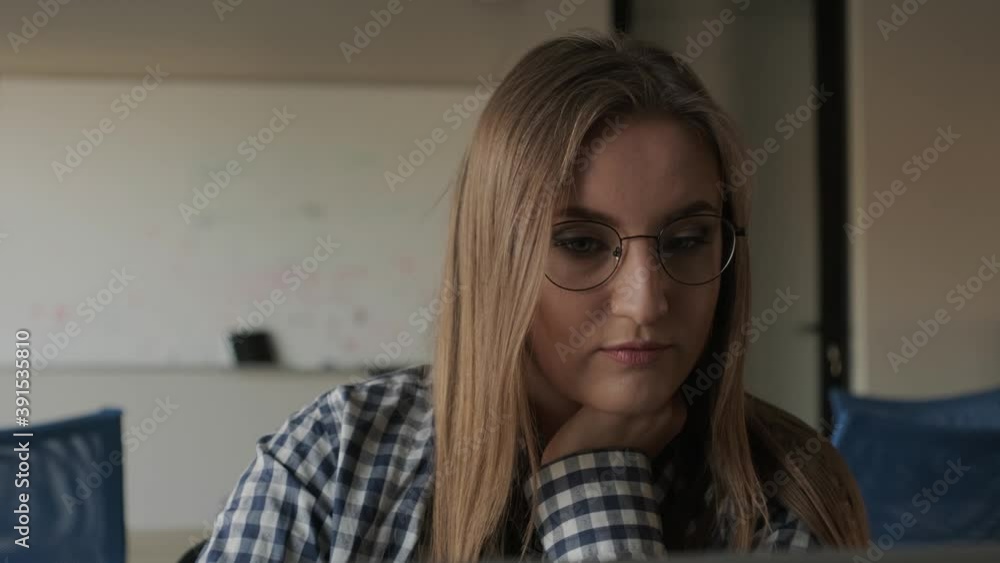 The programmer girl works at the computer Girls in science. In an empty office during a pandemic. The programmer girl works at the computer Girls in science. In an empty office during a pandemic.