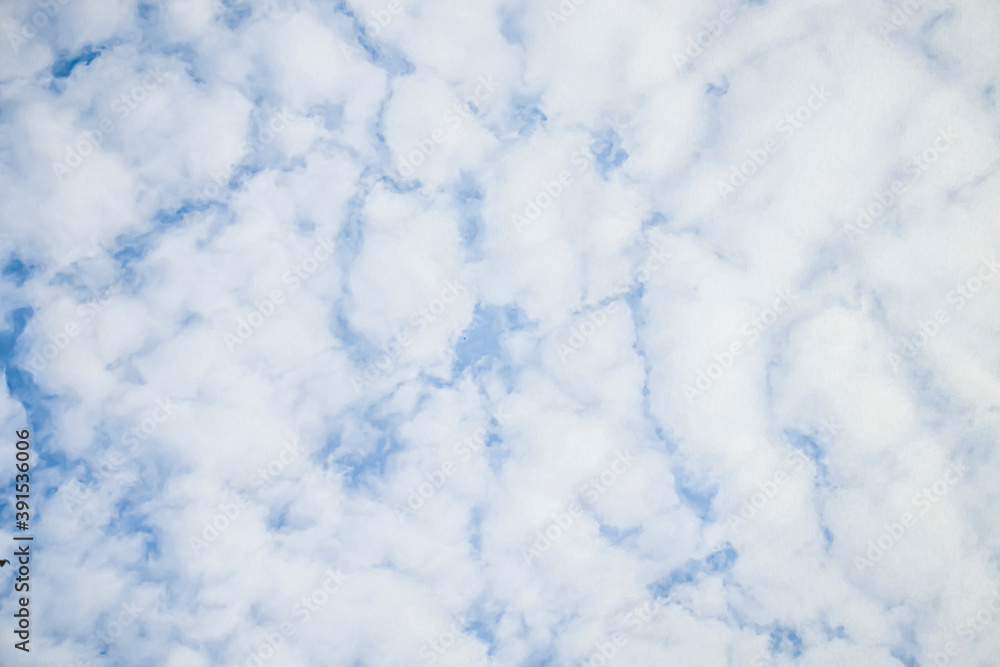 Dense clouds floating in front of the blue sky, clouds background. Dense clouds floating in front of the blue sky, clouds background.