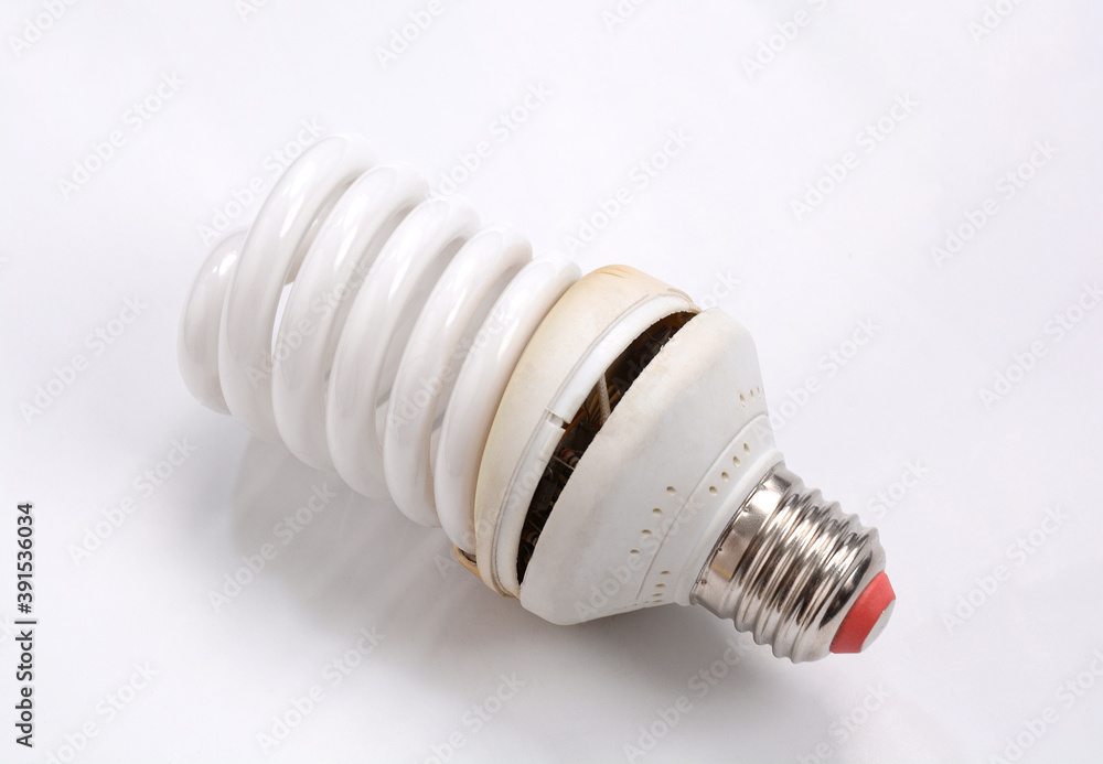 Fluorescent Lightbulbs. One compact old fluorescent light bulb over on white background. Fluorescent Lightbulbs. One compact old fluorescent light bulb over on white background.