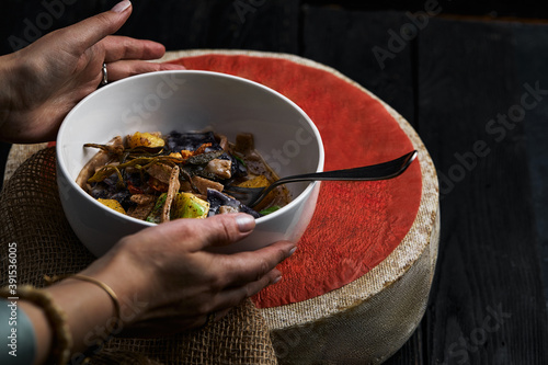 pasta pizzoccheri with chinese cabbage, potato on dark background. italian traditional dish photo