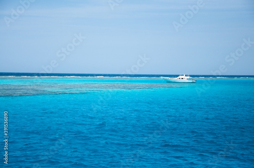 White diving yacht sailing on amazing clear turquoise blue water of Red Sea, Egypt