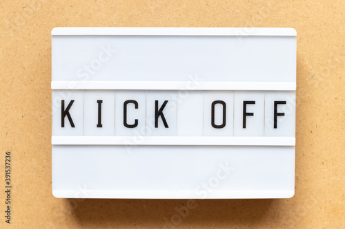 Foto Lightbox with word kick off on wood background
