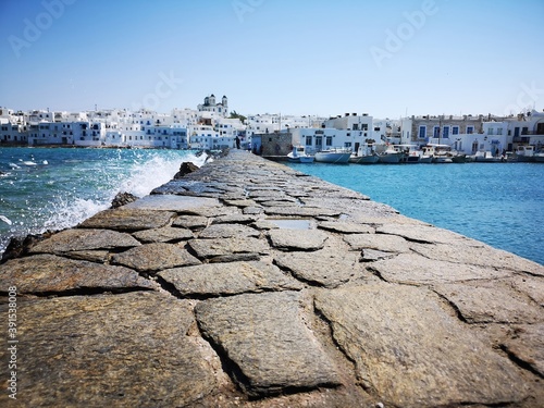 waves crushing against a wall in the harbor of Naousa on the Greek island of Paros © Kevin