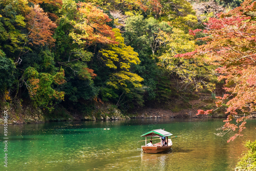 Arashiyama in autumn season along the river. Beautiful place to experience nature in Kyoto, Japan. Arashiyama in autumn season along the river. Beautiful place to experience nature in Kyoto, Japan.