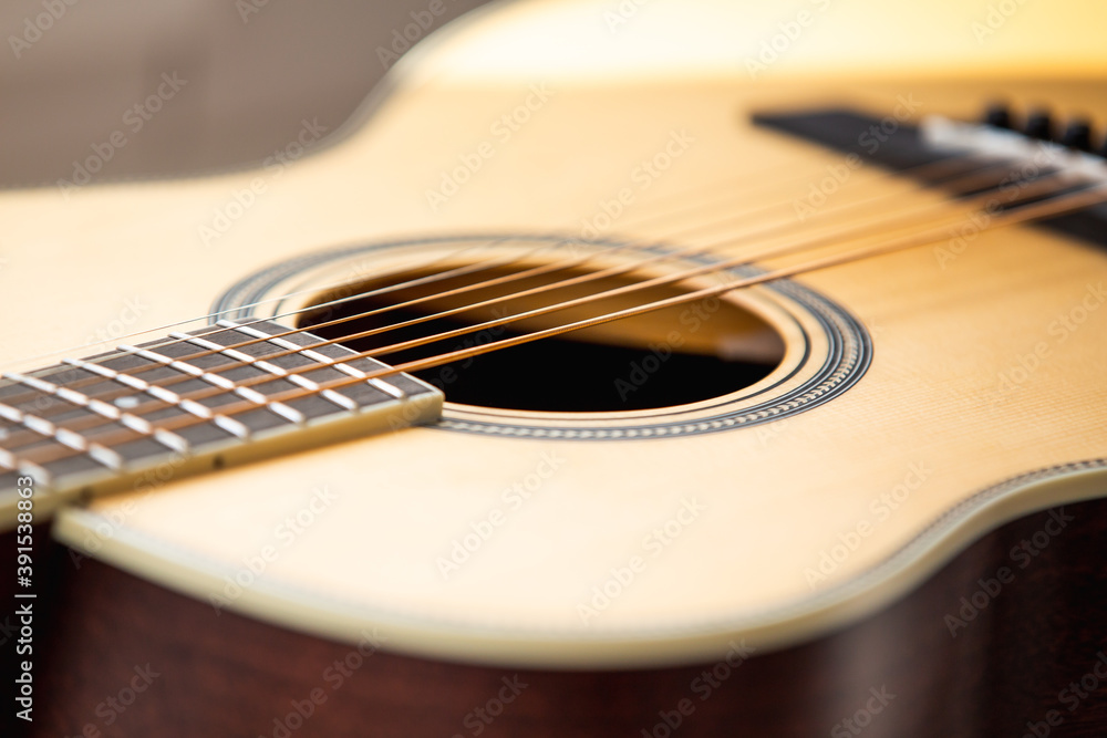 Fototapeta premium Acoustic guitar strings and sound hole close up 