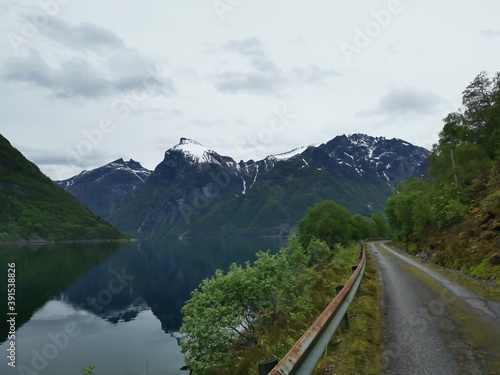 little street along the Hjorundfjord near the village of Bjorke, Norway