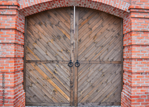 Fotografie antique wooden door with iron ring handle and lock in the monastery building