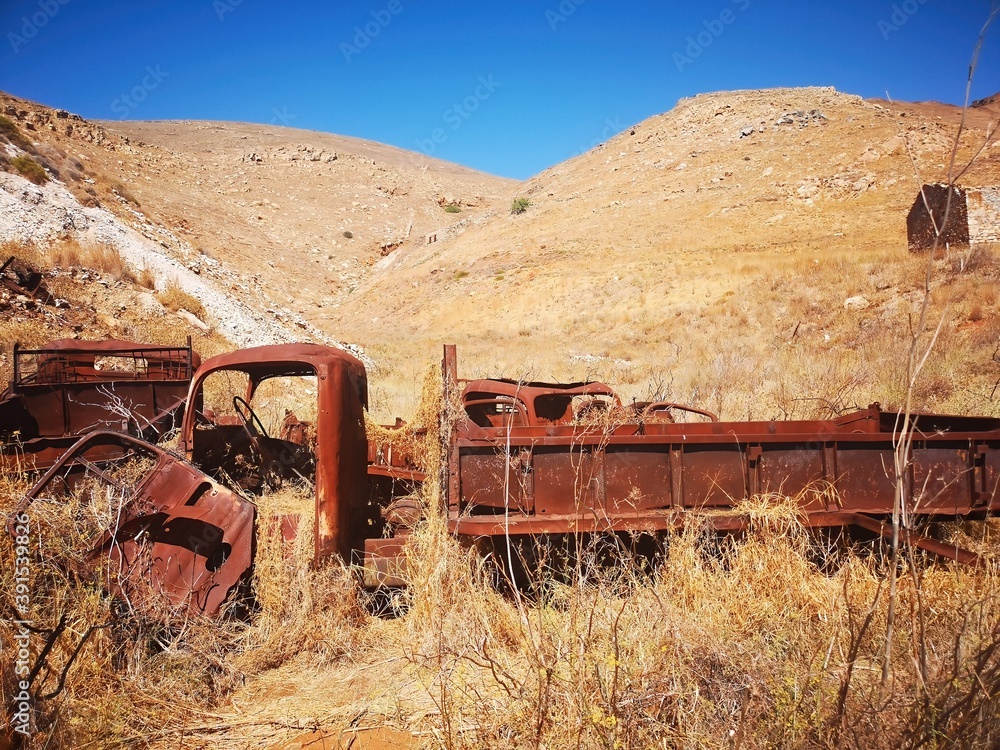 rusty truck wreck on the old mining island of Serifos, Greece