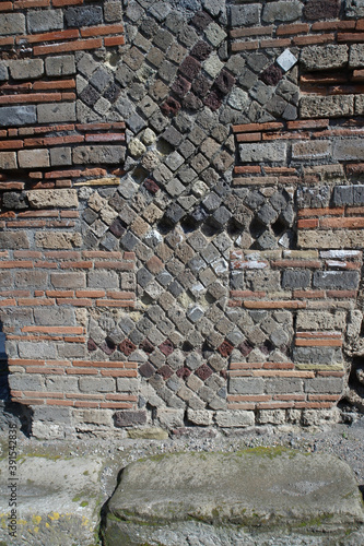 Vertical shot of a brick wall in Pompei italy photo