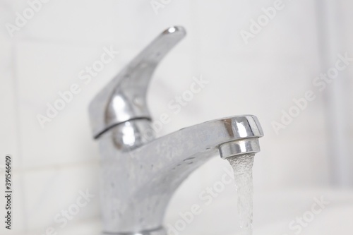 Bathroom faucets are used to wash their hands.