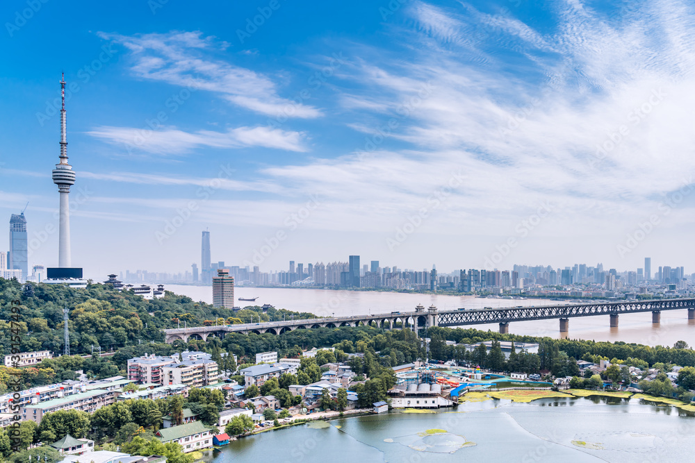Obraz premium Sunny day scenery of Guishan TV Tower and Yangtze River Bridge in Wuhan, Hubei Province, China