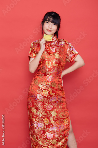 woman wear cheongsam with a credit card shopping