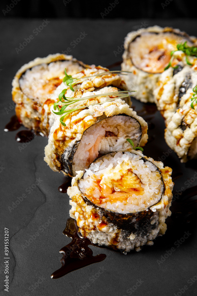 Vertical frame, set of 8 hot rolls on black stone board Vertical frame, set of 8 hot rolls on black stone board