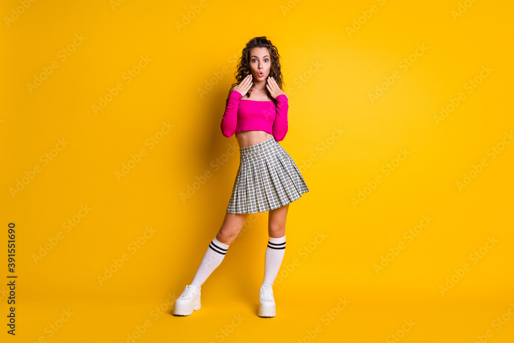 Full length photo of astonished girl in bright clothes shocking news hear isolated over shine vibrant color background Full length photo of astonished girl in bright clothes shocking news hear isolated over shine vibrant color background
