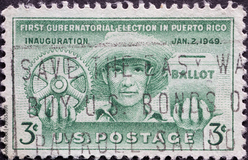 USA - Circa 1949 : a postage stamp printed in the US showing a portrait of a man in a straw hat. First free elections in Puerto Rico