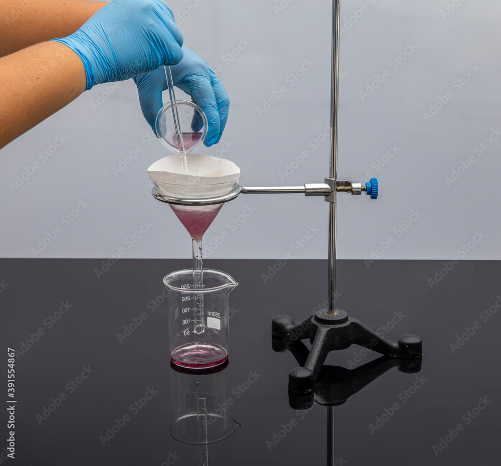 Filter paper in laboratory. Scientists are chemical filtration by