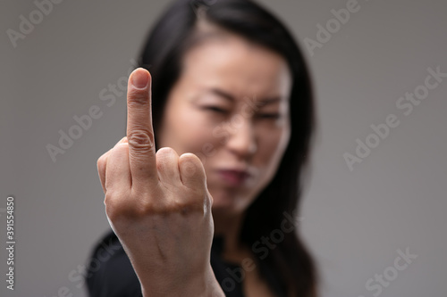 Obraz na płótnie Rude aggressive woman giving the middle finger