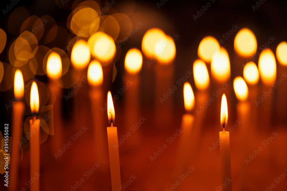 Candles Illuminated On Christmas. Beautiful group of candles lit during Diwali Festival night with light bokeh background. Concept for holiday, festive celebration, hanukkah, christmas, church, temple Candles Illuminated On Christmas. Beautiful group of candles lit during Diwali Festival night with light bokeh background. Concept for holiday, festive celebration, hanukkah, christmas, church, temple