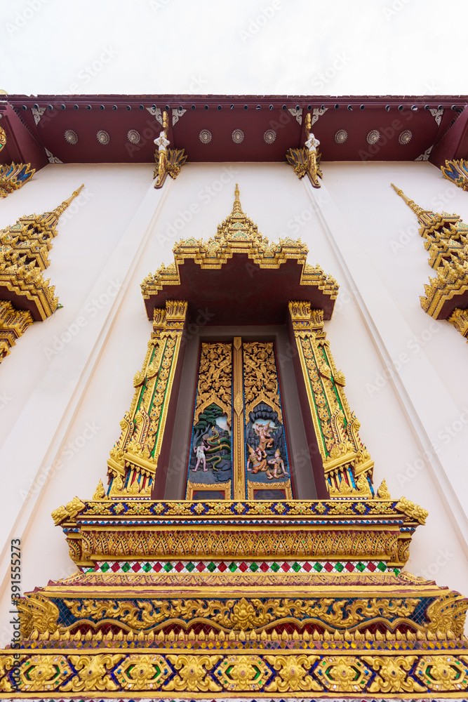 The beautiful of thai style windows. External view of the church in temple.