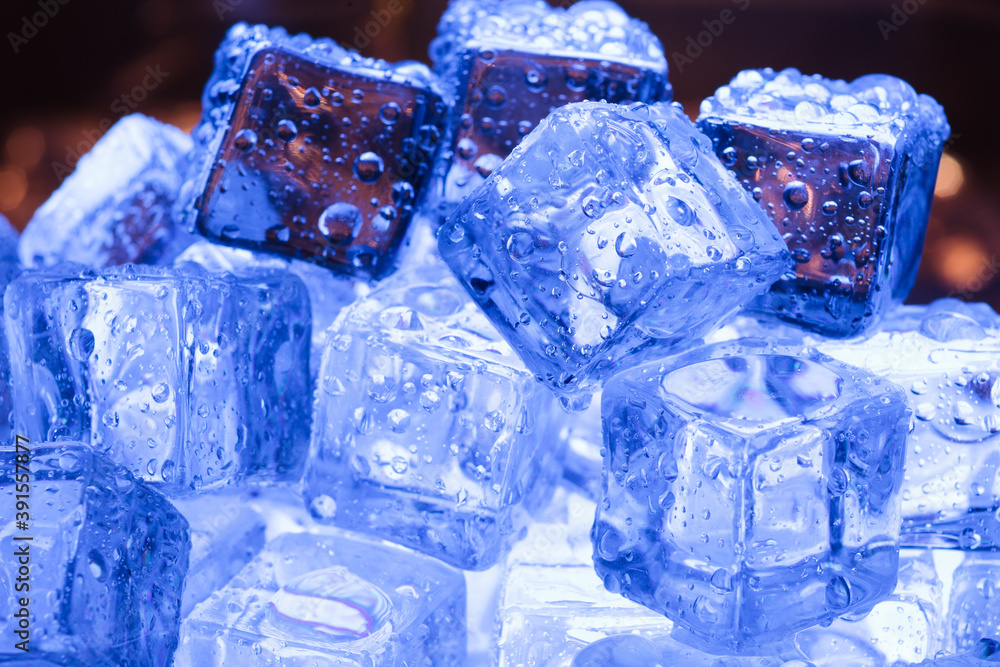 Ice cubes pile close-up with warm background Ice cubes pile close-up with warm background
