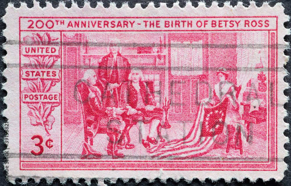 USA - Circa 1952 : a postage stamp printed in the US showing Betsy Ross showing the flag to the Flag Committee - General George Washington, Robert Morris, and George Ross. Text: the birth Betsy Ross