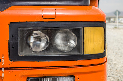 Headlight of a large truck close-up