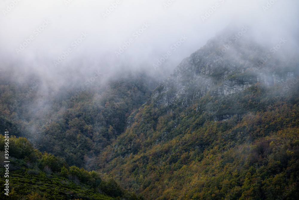 Low clouds cover the peaks of the Sierra de Oribio