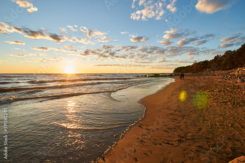 sunset on the sandy beach of the gulf of finland