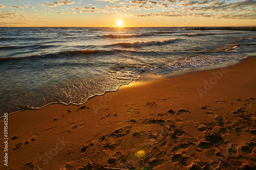 sunset on the sandy beach of the gulf of finland