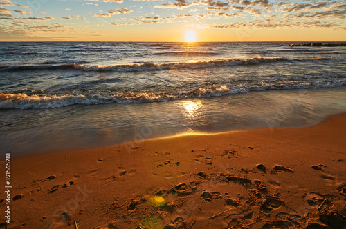 sunset on the sandy beach of the gulf of finland