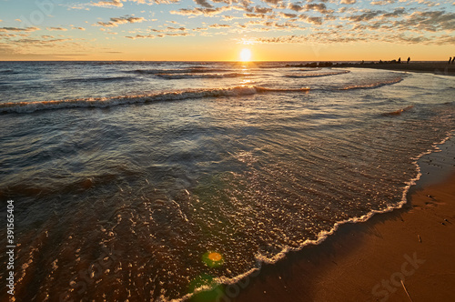 sunset on the sandy beach of the gulf of finland
