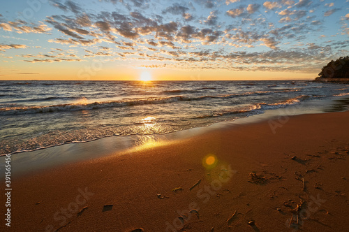 sunset on the sandy beach of the gulf of finland