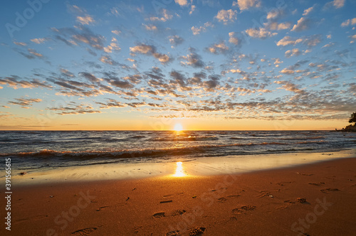 sunset on the sandy beach of the gulf of finland