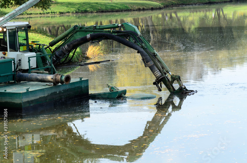 Quadro em tela Floating dredge deepens the bottom of the water-management environment