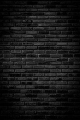 Black brick walls that are not plastered background and texture. The texture of the brick is black. Background of empty brick basement wall.