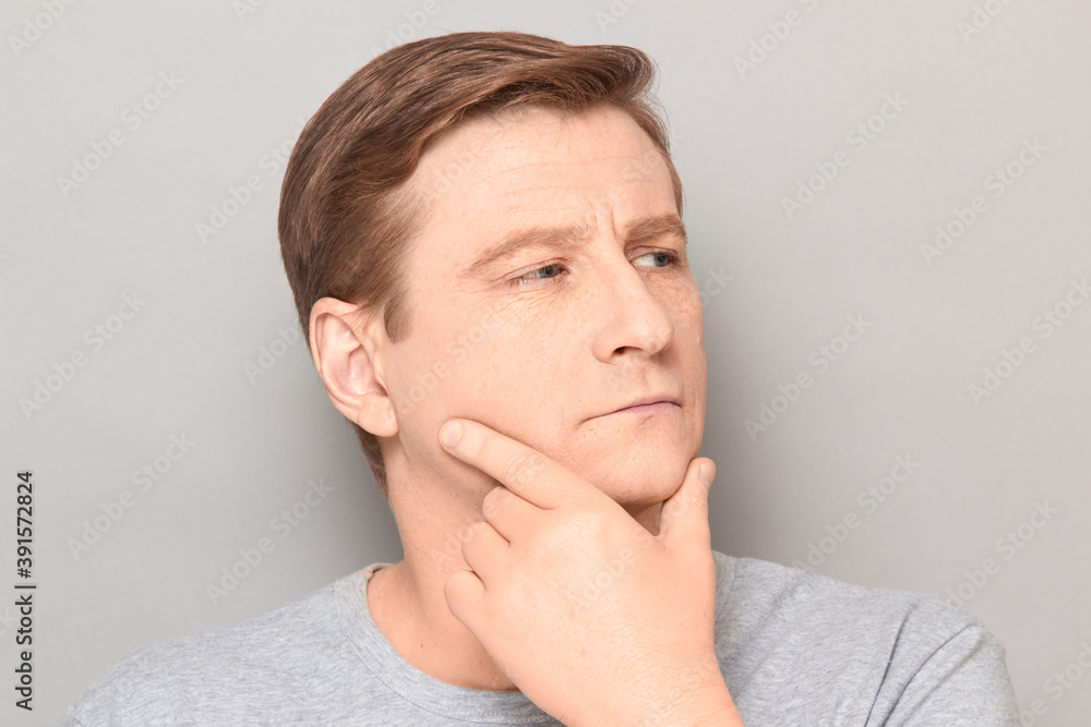 Portrait of thoughtful focused man with serious expression on face Portrait of thoughtful focused man with serious expression on face