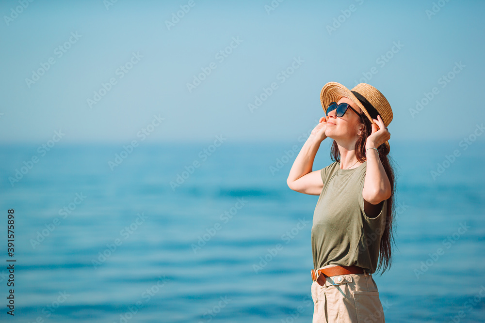 Young beautiful woman having fun on tropical seashore. Young beautiful woman having fun on tropical seashore.