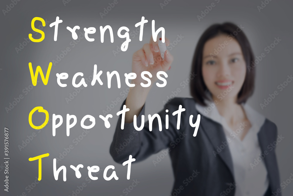 businesswoman writing swot analysis businesswoman writing swot analysis