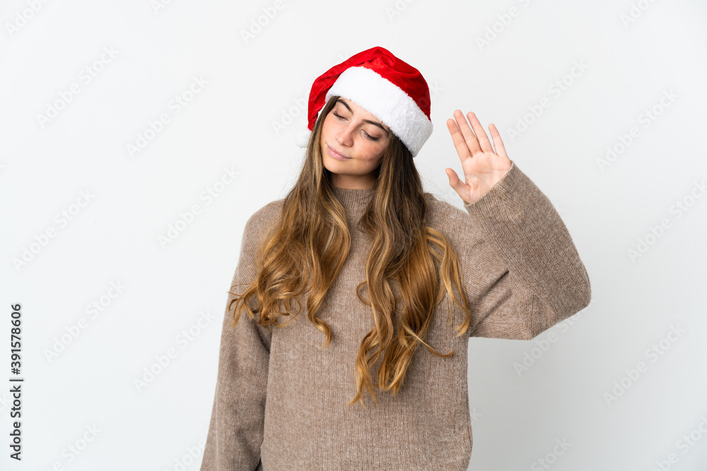 Caucasian girl with christmas hat isolated on white background making stop gesture and disappointed Caucasian girl with christmas hat isolated on white background making stop gesture and disappointed