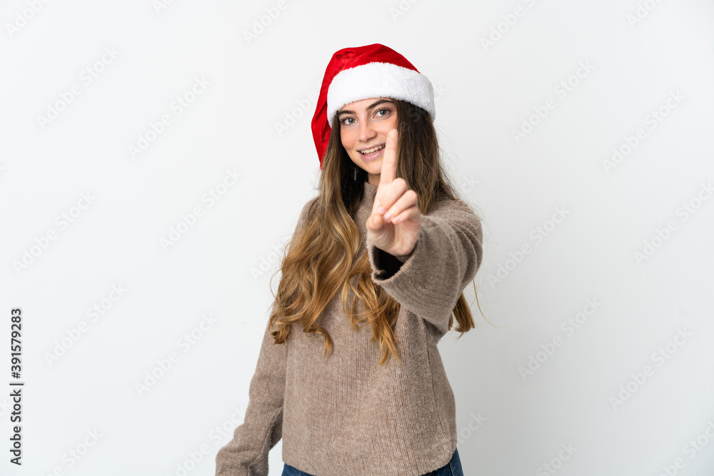 Caucasian girl with christmas hat isolated on white background showing and lifting a finger