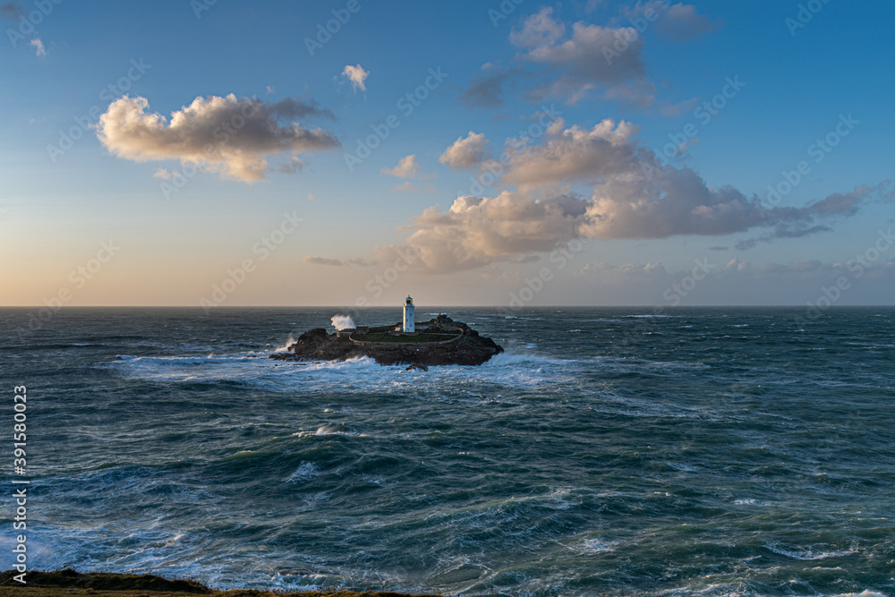 Fototapeta premium Rough seas hitting Godrevy island, Cornwall, in late autumn