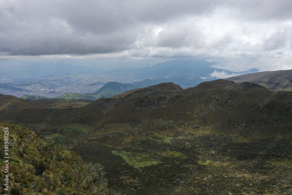 Aerial view of mountain slope cover in small green grasses with a heavy overcast Aerial view of mountain slope cover in small green grasses with a heavy overcast